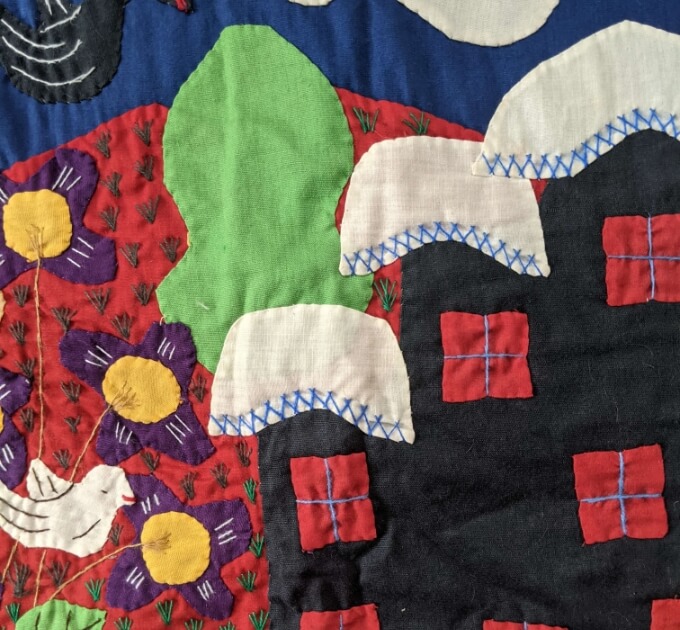 Colorful patterns on a quilt from Ecuador